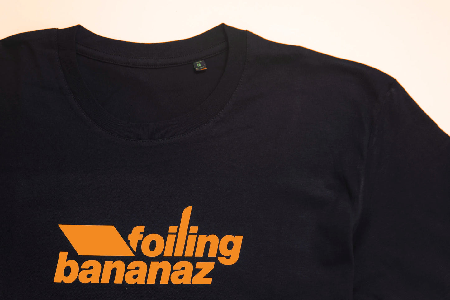 Foiling Bananaz Black Tee with Orange logo details