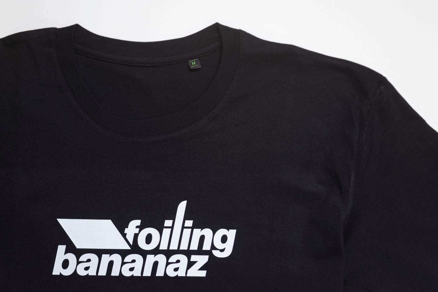 Black tee close upwith Foiling Bananaz white logo